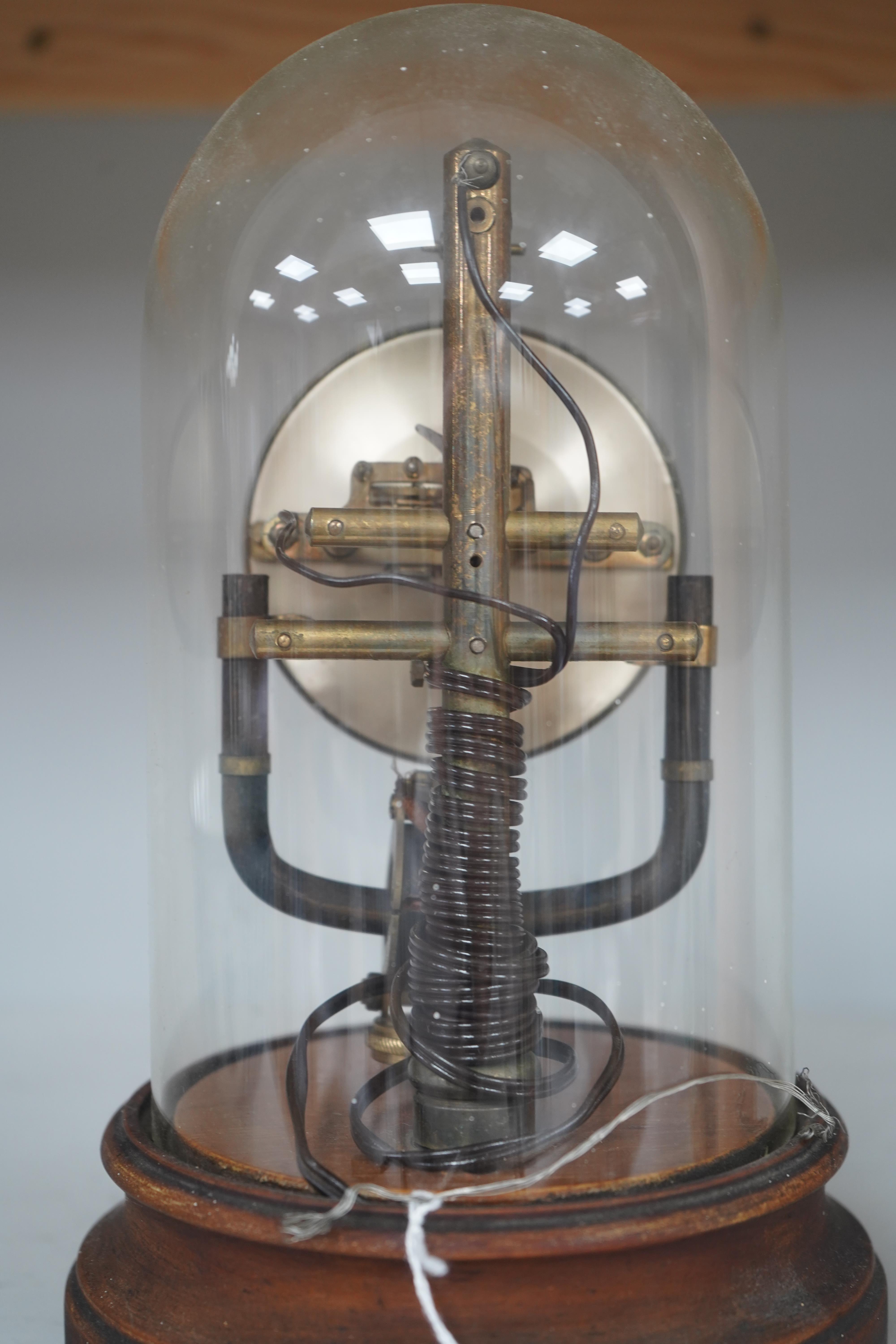 A Bulle type 800 day electric clock, under a glass dome, 26cm high. Condition - fair, untested